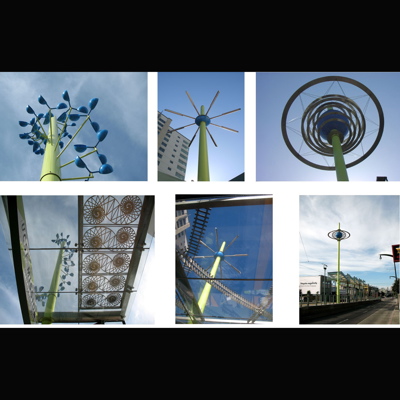 artwork enhancements for 7 platforms on San Franciscoís MUNI Third St. Light Rail in the Mission Bay area. Platform designs includeKinetic Helix marquee pole and shadow caster panels based on the Fibonacci spiral at the UCSF biotechnology campus station, Turbine marquee with shadow casters based on historical train yards, Flight marquee pole and shadow caster canopies of laser cut native bird silhouettes. Paving embedments and windscreens are based on historical train names, native birds, and Long Bridge, a horse car rail line that once traced the same route. Commissioned by the SF Arts Commission. Structural engineer: Paul Endres, Endres-Ware. Fabrication by Eastern Sheet Metal