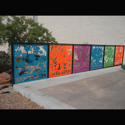 Fence panels of native flowers inspired by Mexican papel picado (cut paper) techniques. Fabricated of powder coated steel. Each panel: 5' X 5'. Commissioned by the City of El Paso Museums and Cultural Affairs Dept. 